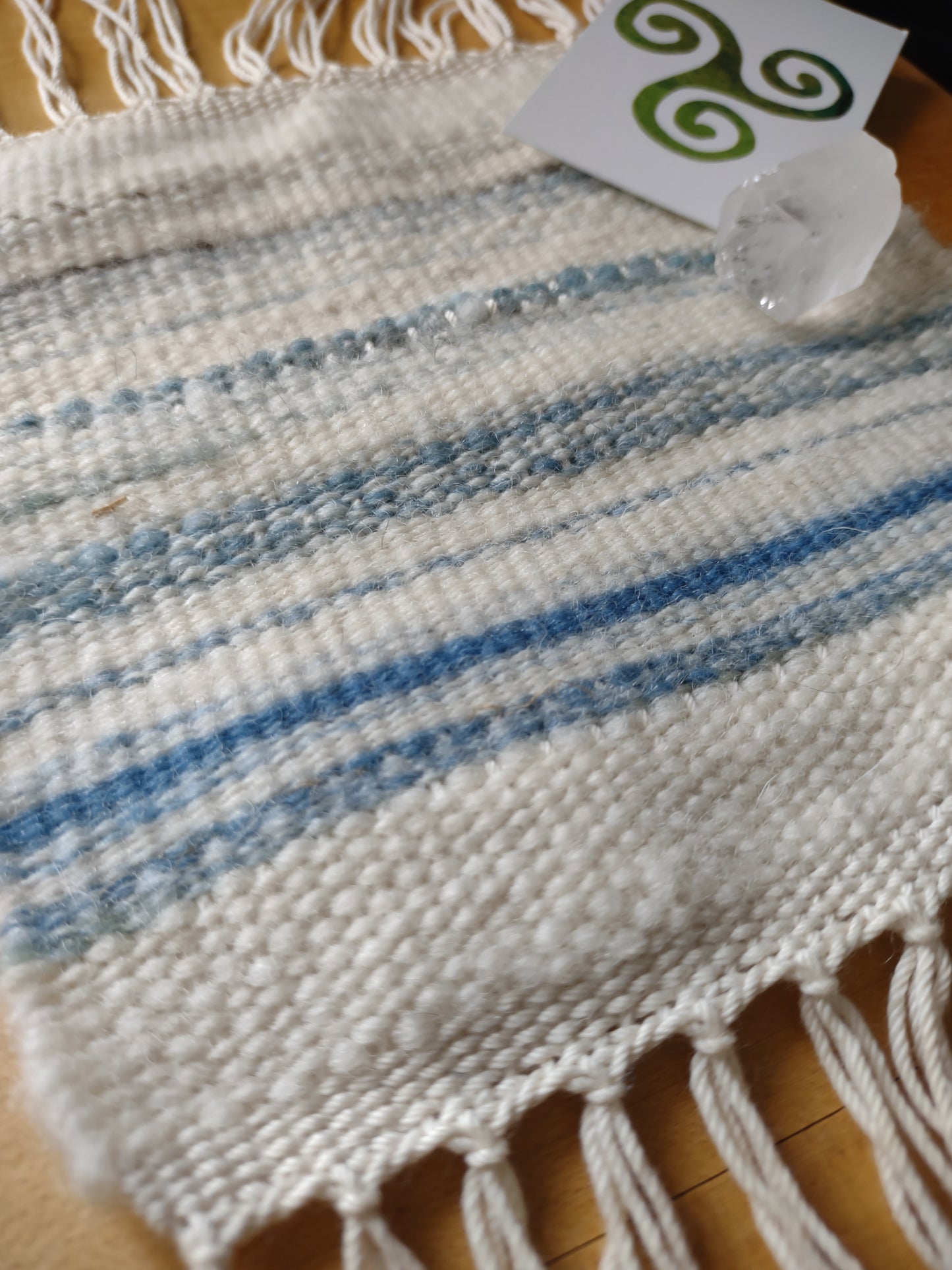 Small weaving with creamy white various blues and teal. Handspun wool. Mug rug, altar cloth, anything you choose.