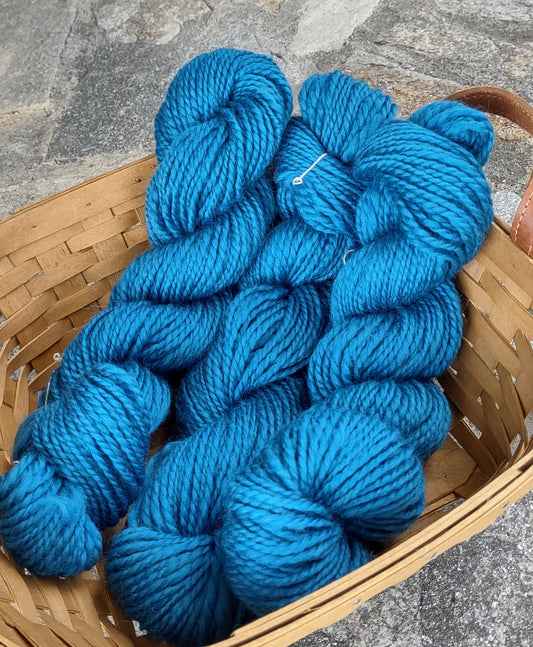 3 small skeins in cerulean blue Corriedale wool yarn, handspun by me.