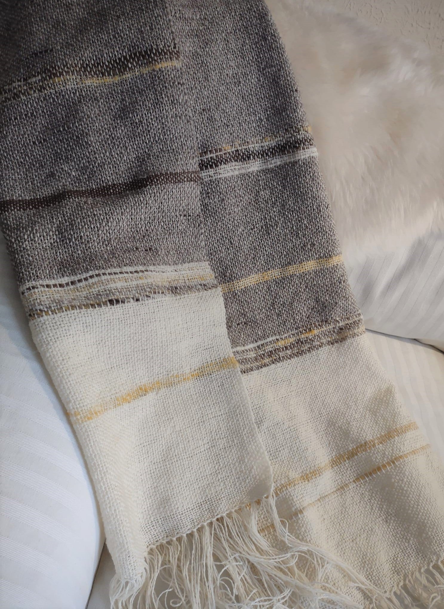 Handwoven shawl with handspun wool yarn: natural tones and a hint of honey yellow