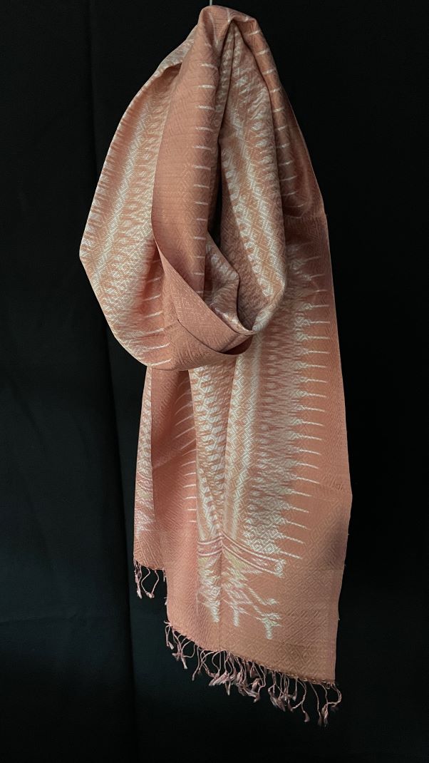 From Surin province in Thailand, this luxurious shawl is 100% handwoven silk.  The dyes are natural from leaves, bark and flowers, creating color that is rich but subtle: rose, pink, hints of green and ivory. 